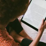 Person reading an eBook on a tablet